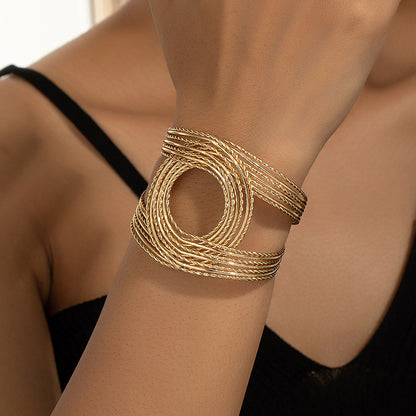 Artistic Twist Gold Cuff Bracelet: Modern Chic!